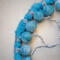 details of acrylic yarn and 8mm marble blue look glass beads